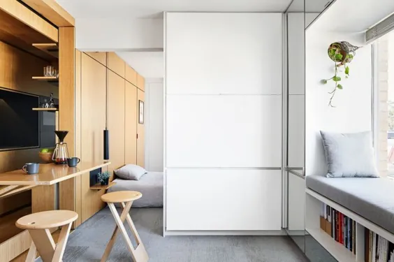 این آپارتمان با متراژ 35 متر اتاق خواب را در پشت دیوارهای کشویی پنهان می کند