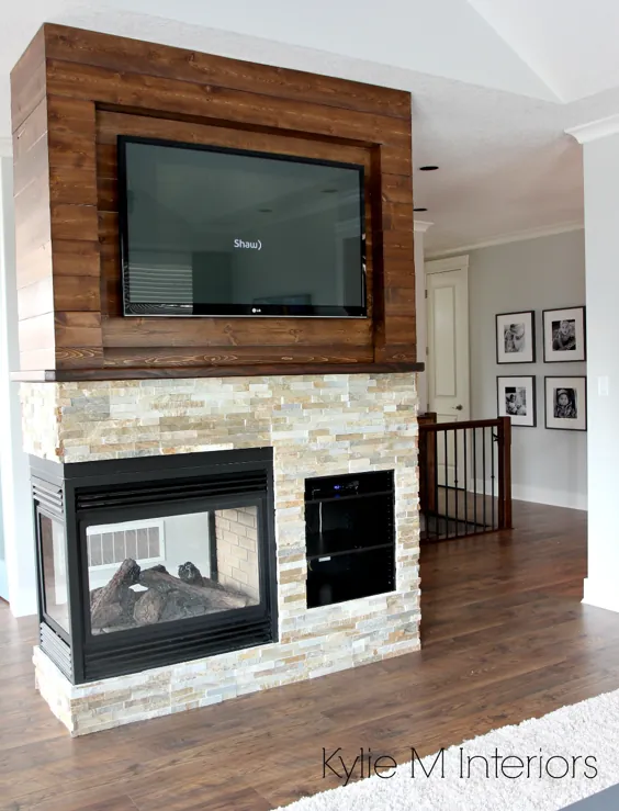 شومینه سنگی لجستون 3 سنگی با تخته چوبی که لکه دار شده است.  تلویزیون در بالا نصب شده است.  Kylie M Interiors طراحی الکترونیکی و مشاوره آنلاین