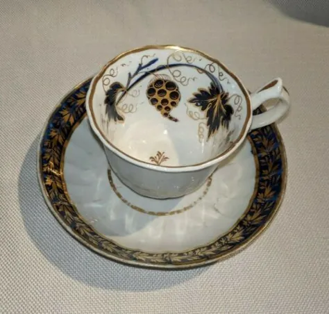 فنجان چای پرسلان پرنعمت و نعلبکی آبی و طلایی با علامت 206