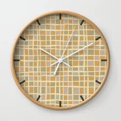 الگوی موزاییک در ماسه های طلایی رنگ ساعت دیواری توسط وام ها